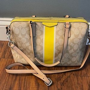 Signature Coach handbag. Yellow/Tan.